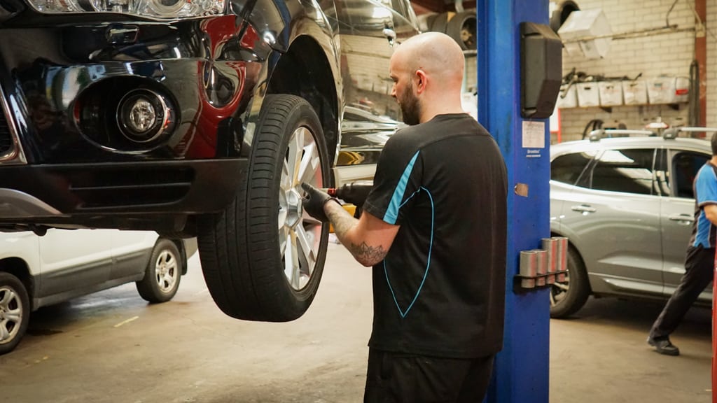 mechanic completing esafety check for brakes and tires at avoca auto randwick